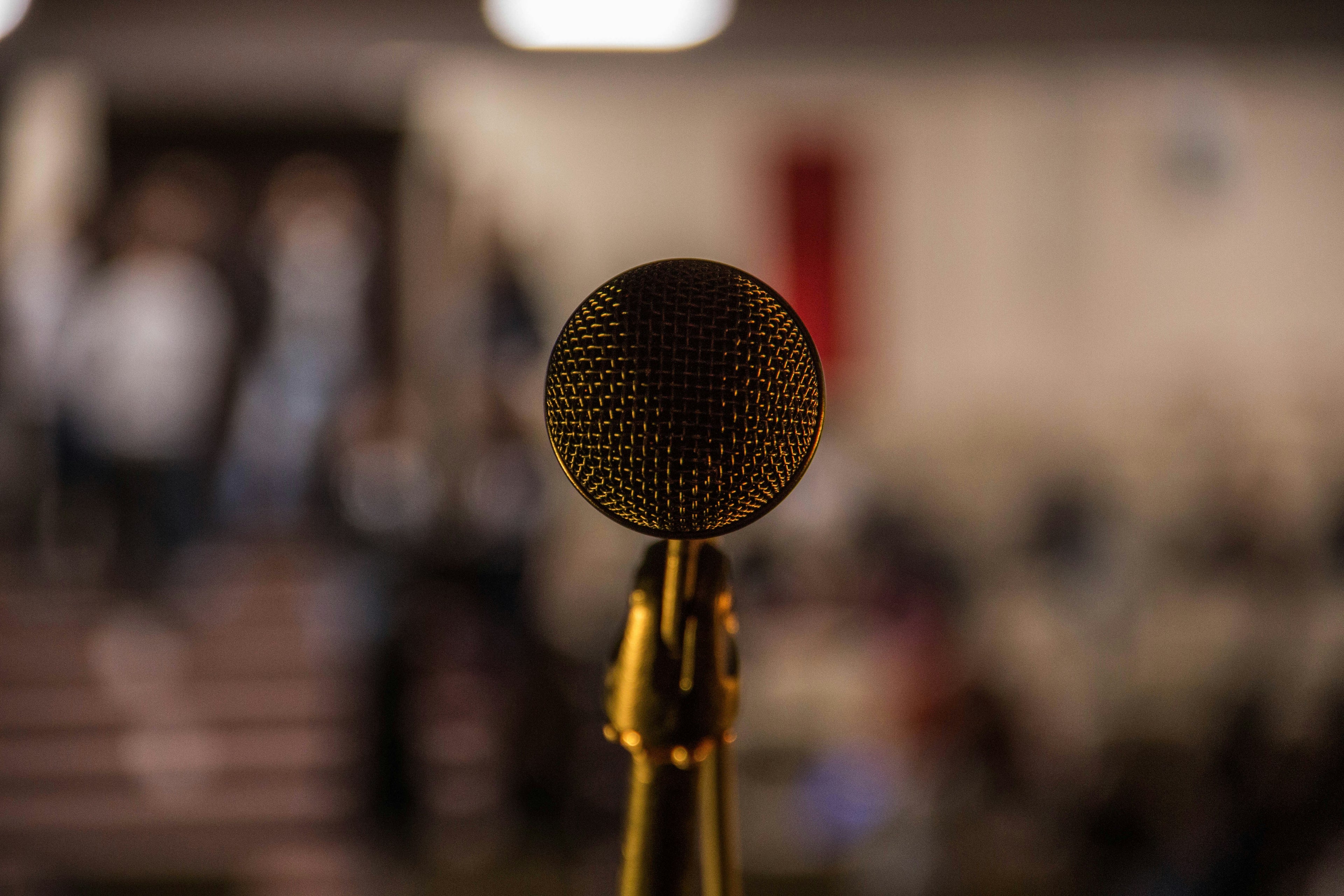 Microphone with blurred audience in the background